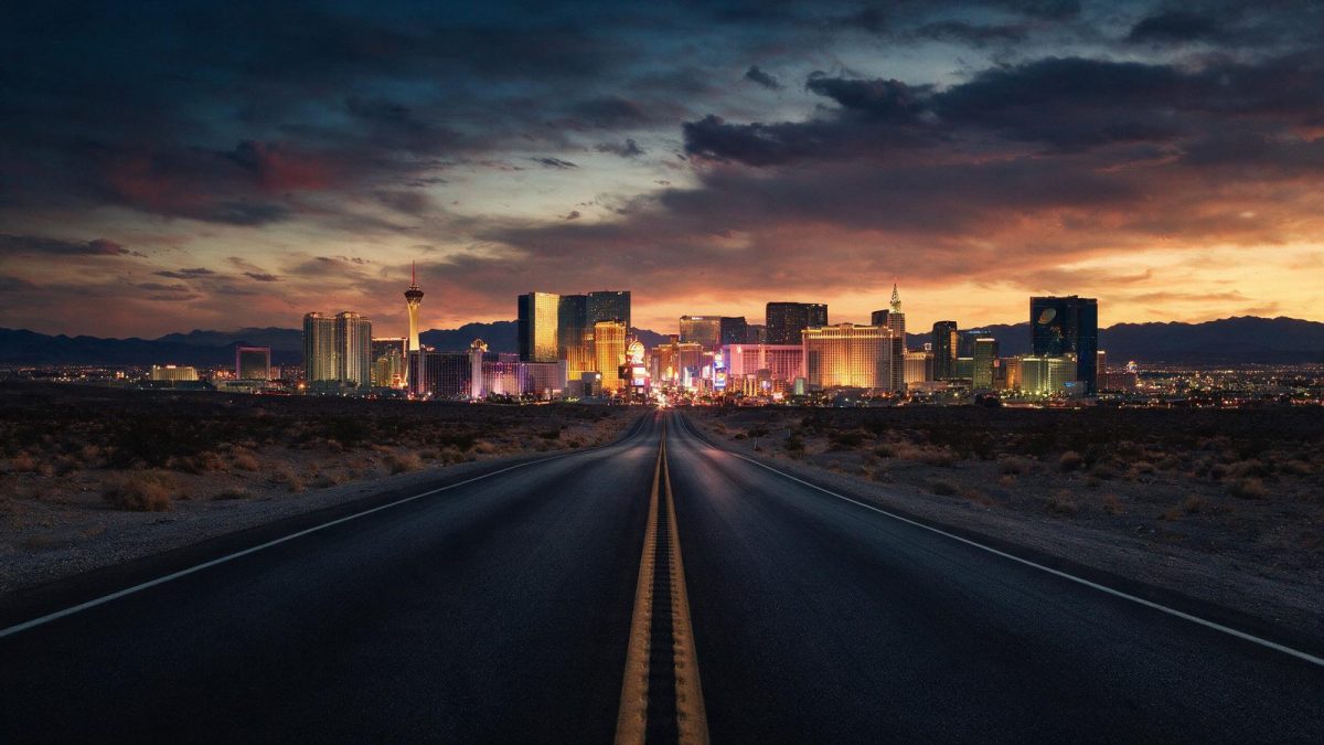 Desert highway leading into the Las Vegas skyline at dusk, Nevada LLC guide