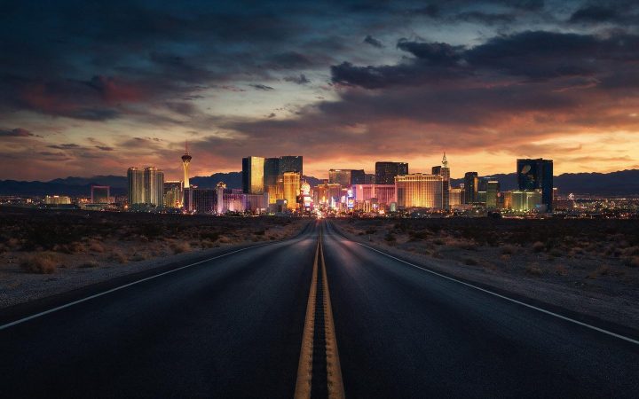 Desert highway leading into the Las Vegas skyline at dusk, Nevada LLC guide